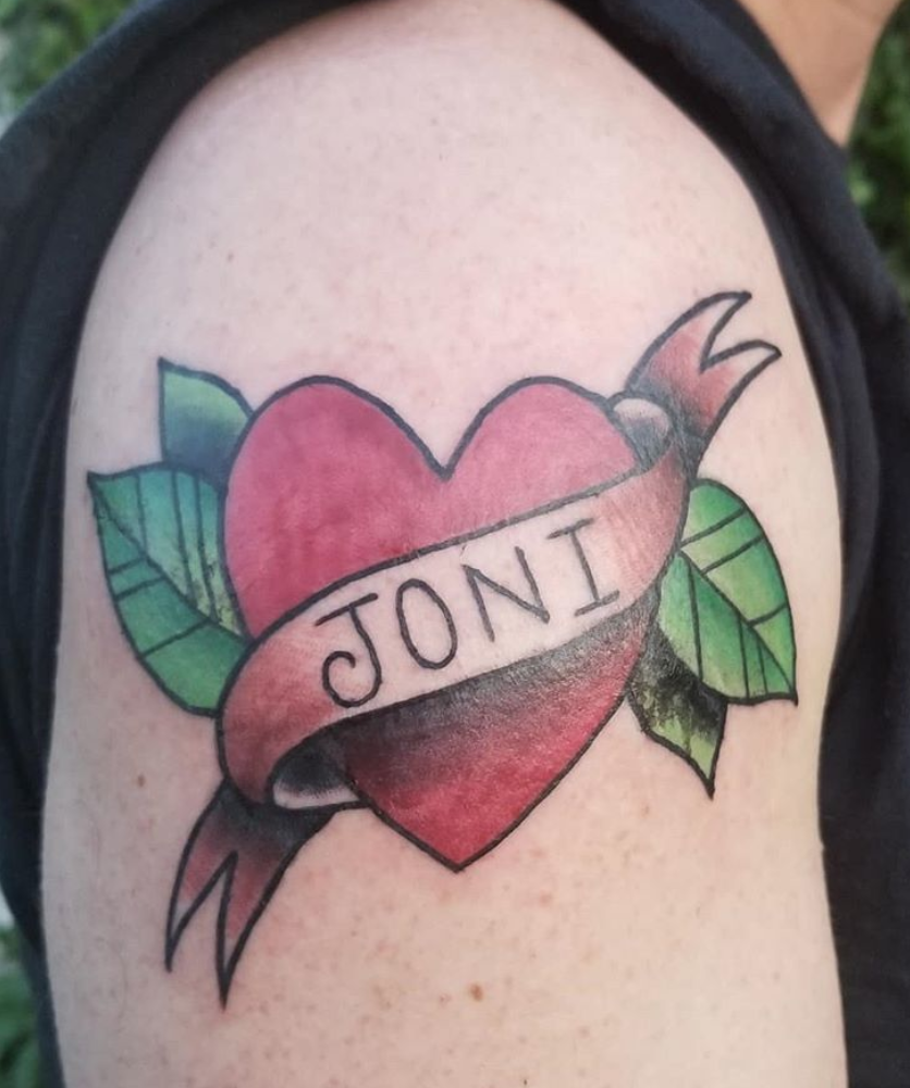 Couples traditional heart name tattoo.