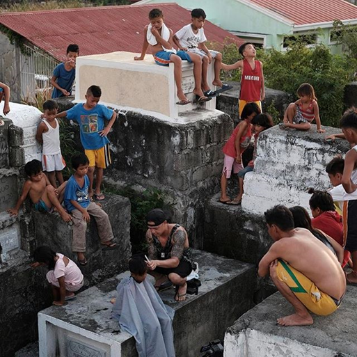 Mark Bustos gives haircuts to impoverished children during his May, 2017 trip to San Nicolas, Pampanga, Philippines. Photo Credit: @MarkBustos Instagram