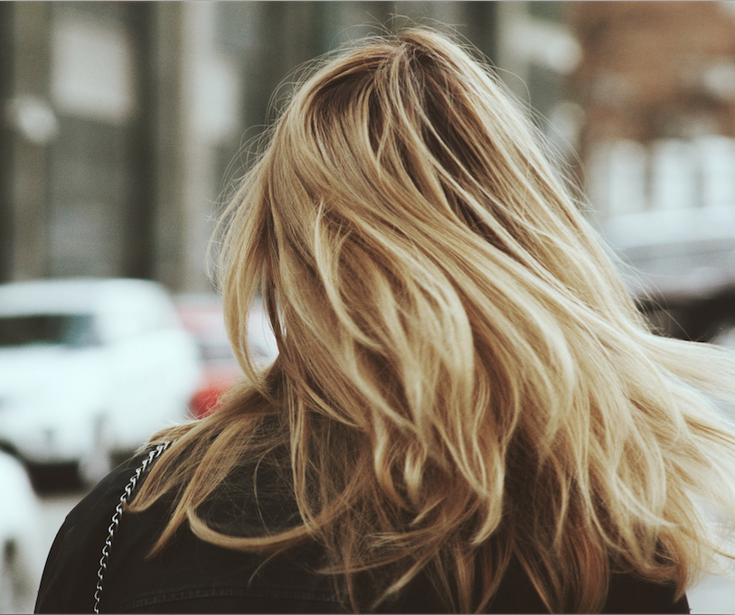 Keeping dyed blonde hair moisturized is a lot of work, friends. (Image Credit: Unsplash/Alex Suprun)