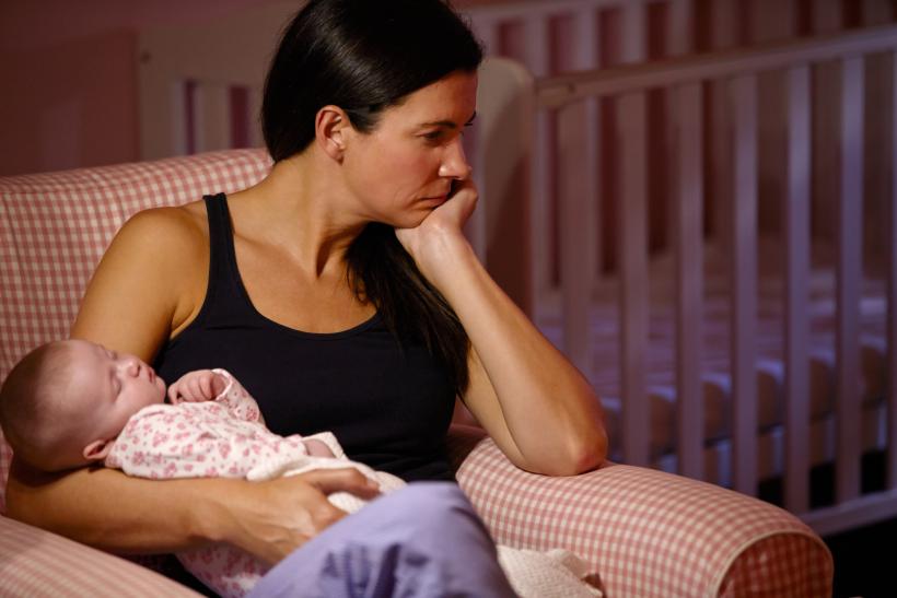 A mother's moment of joy, overshadowed by national tragedy. (Image Credit: Think Stock) A mother's moment of joy, overshadowed by national tragedy. (Image Credit: Think Stock)