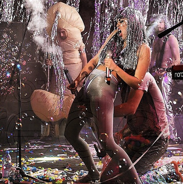 Courtesy of Facebook. Miley serenades a few schlongs at Art Basel Courtesy of Facebook. Miley serenades a few schlongs at Art Basel