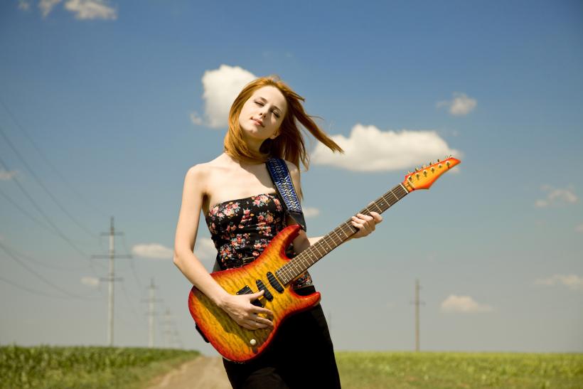 "When you’re wearing your belly-covering guitar, people will think you’re a real cool rock lady who spends the time when she’s not writing songs totally probably going to the gym." Image: Thinkstock