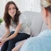 a woman sitting with her therapist