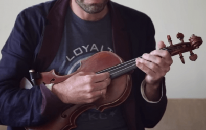 Screenshot of Andrew Bird's perfect, perfect fingers strumming away at his perfect, perfect cover.